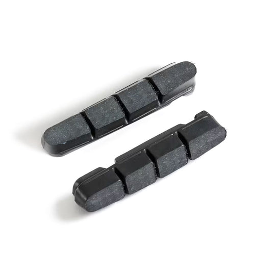 Pair of Scribe Carbon Rim Brake Pads designed for carbon wheels, featuring grooved surface for improved water clearance and maximum braking power.
