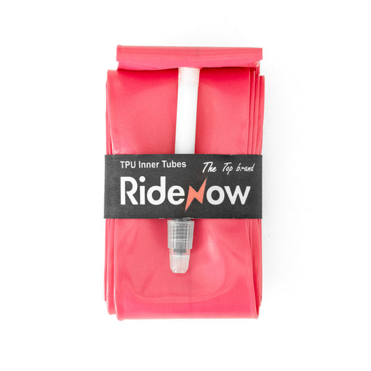 RideNow pink bicycle inner tube folded with valve — durable, smooth, and reliable for road cycling.
